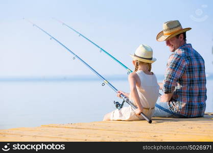 Father and daughter fishing. Father and daughter fishing on the pier