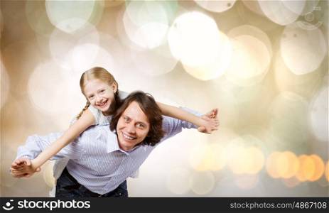 Father and daughter. Happy family of father and daughter against bokeh background