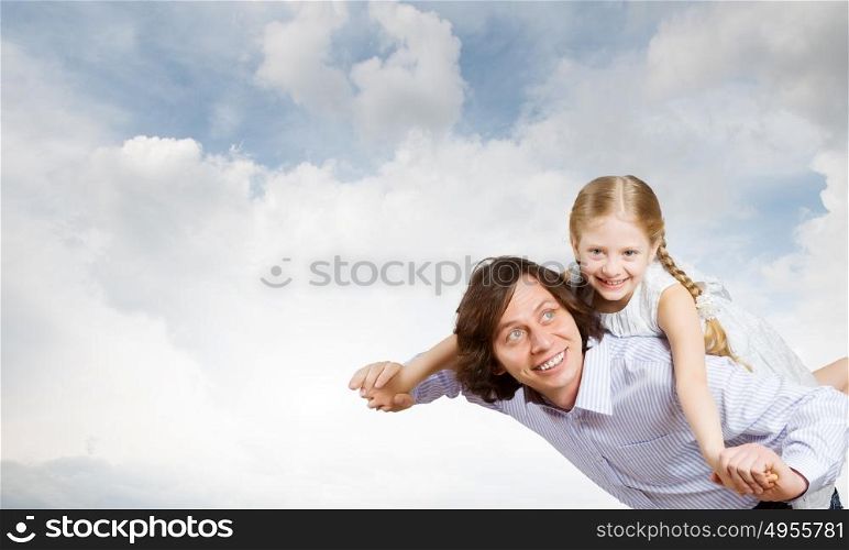 Father and daughter. Happy family of father and daughter against bokeh background