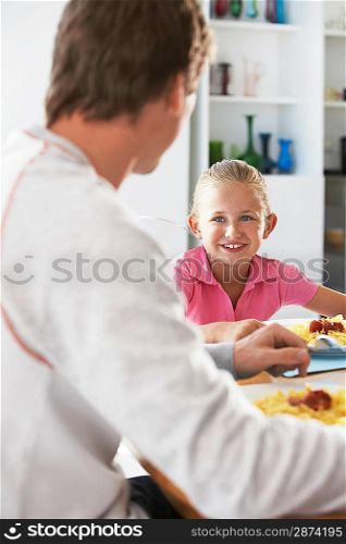 Father and Daughter Having a Meal