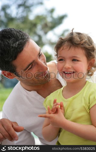 Father and daughter having fun at the park