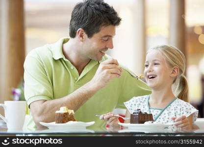 Father And Daughter Having Lunch Together At The Mall