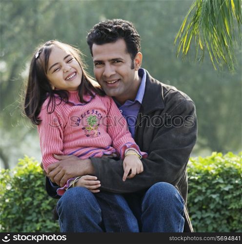 Father and daughter in a park