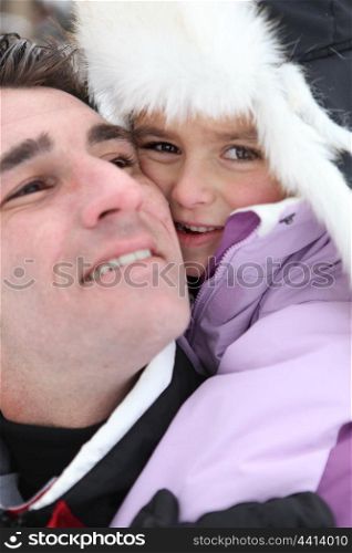 Father and daughter in ski holidays