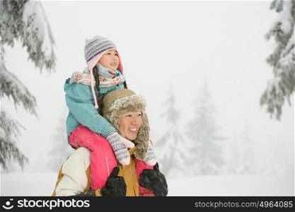 Father and daughter in snow