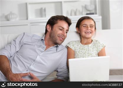 Father and daughter laughing