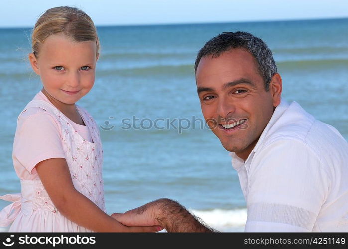 Father and daughter on beach