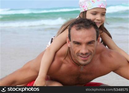 Father and daughter on beach