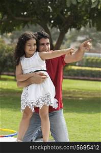 Father and daughter pointing