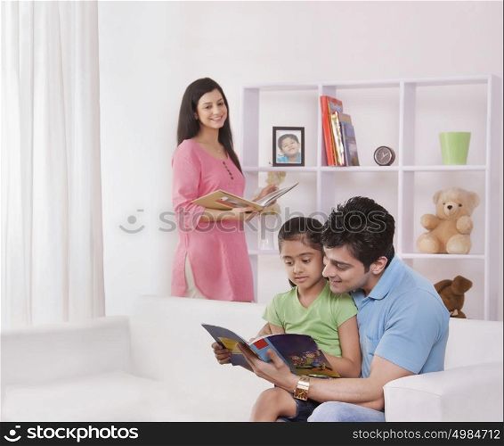 Father and daughter reading a storybook
