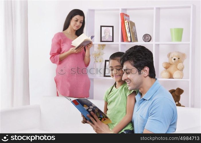 Father and daughter reading a storybook