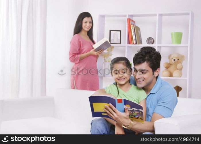 Father and daughter reading a storybook