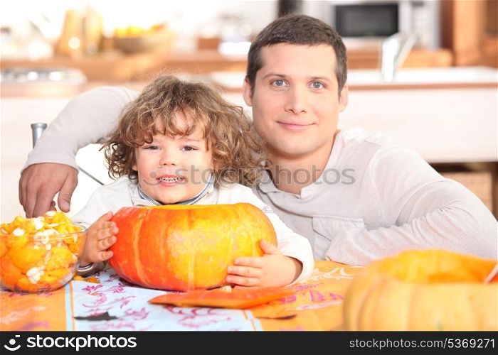 father and his little boy making a pumpkin pie