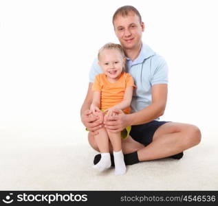 father and little daughter doing sport together