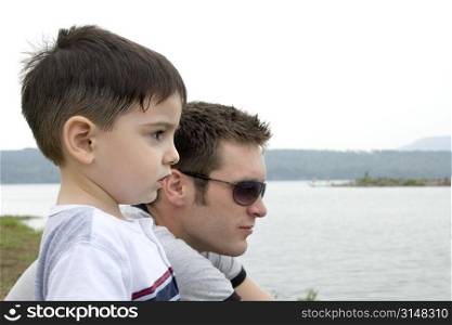 Father and son at lake.