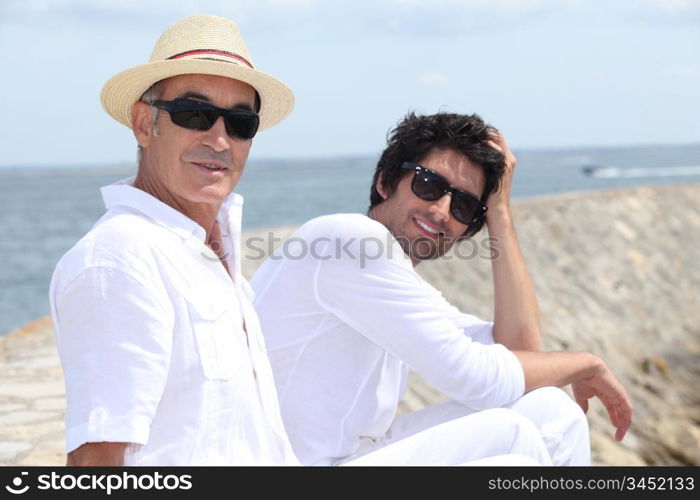 Father and son by the ocean