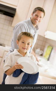 Father And Son Cleaning Dishes