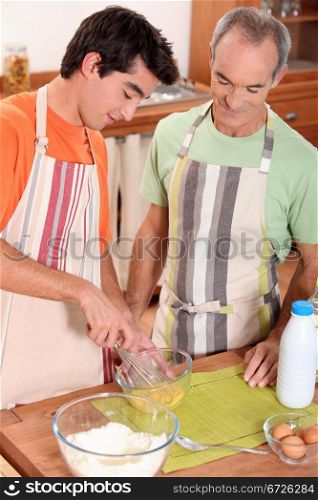 father and son cooking