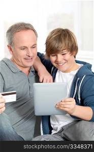 Father and son doing online shopping