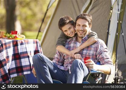 Father And Son Enjoying Camping Holiday In Countryside