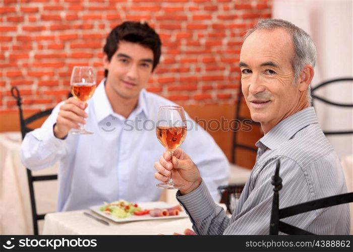 Father and son having lunch