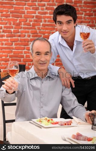 Father and son having meal together