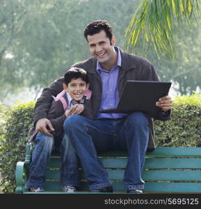 Father and son in a park
