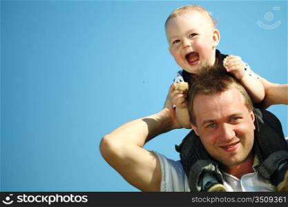 father and son in blue sky