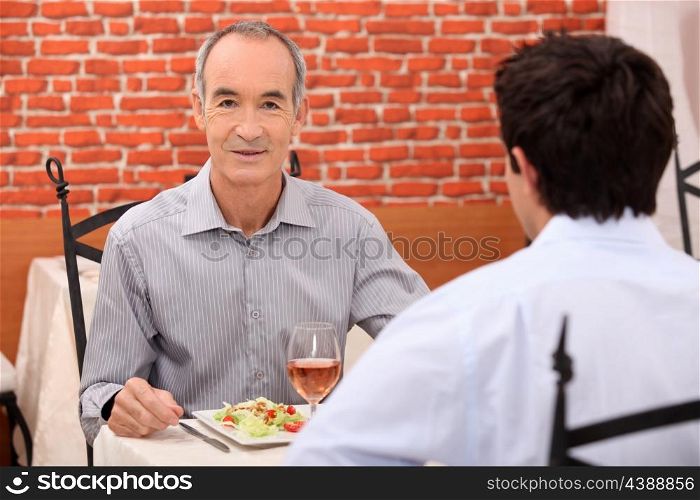 Father and son in restaurant