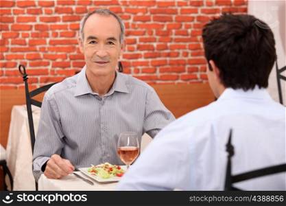 Father and son in restaurant