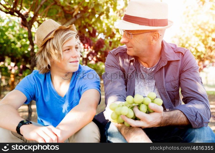 Father and son in vineyard. Father and son together in vineyard