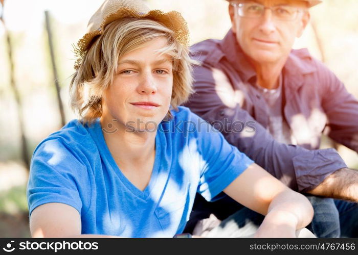 Father and son in vineyard. Father and son together in vineyard