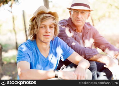 Father and son in vineyard. Father and son together in vineyard