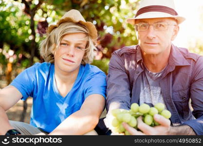 Father and son in vineyard. Father and son together in vineyard