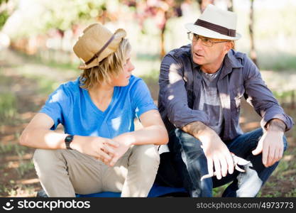 Father and son in vineyard. Father and son together in vineyard