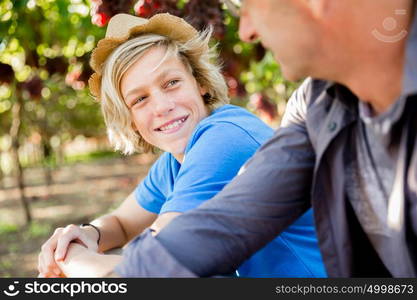 Father and son in vineyard. Father and son together in vineyard