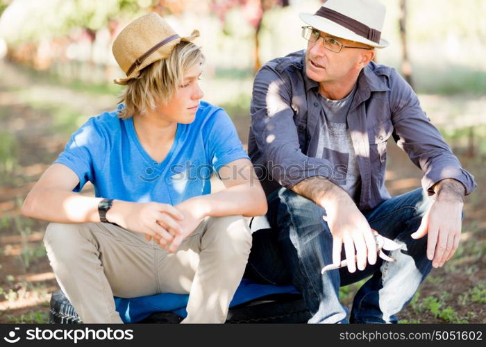 Father and son in vineyard. Father and son together in vineyard