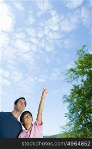 Father and son looking at clouds