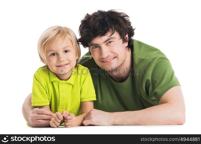 Father and son lying on the floor. Father and son lying on the floor isolated on white background