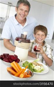 Father And Son Making Fresh Vegetable Juice