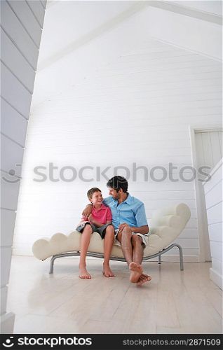 Father and Son on Chaise Longue