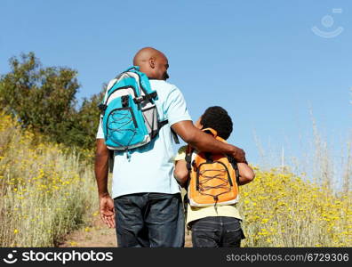 Father and son on country hike