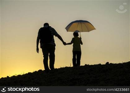 father and son reached the summit sunset