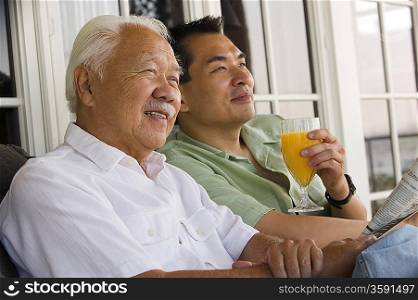 Father and Son Relaxing at Breakfast