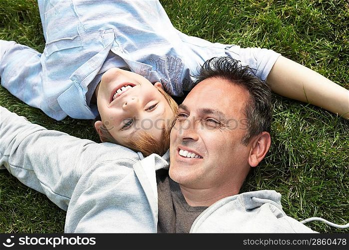 Father and Son Relaxing in the Grass