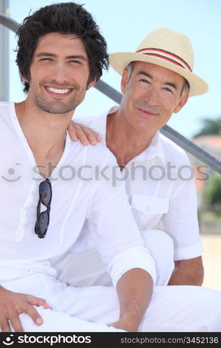 Father and son sitting on stairs