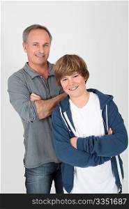 Father and son standing on white background