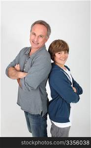 Father and son standing on white background