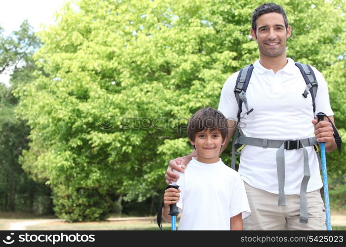 father and son walking in the park