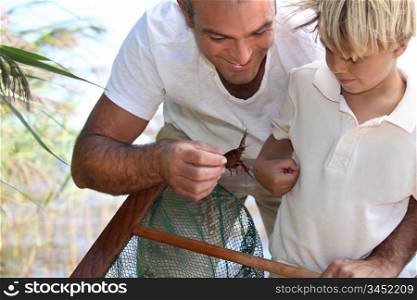 Father and son with a fishing net
